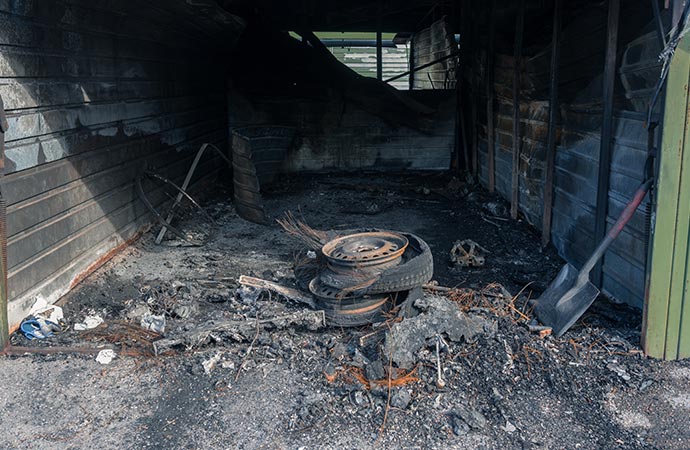 Car garage damaged by fire
