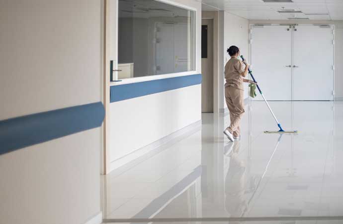 cleaning health care facility floor