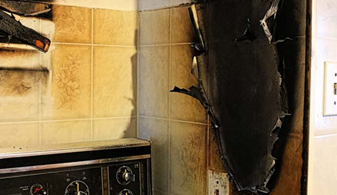 kitchen stove and walls after a fire