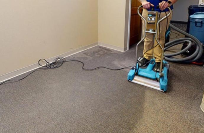 Restoring water-damaged carpet to its original condition with professional restoration services.