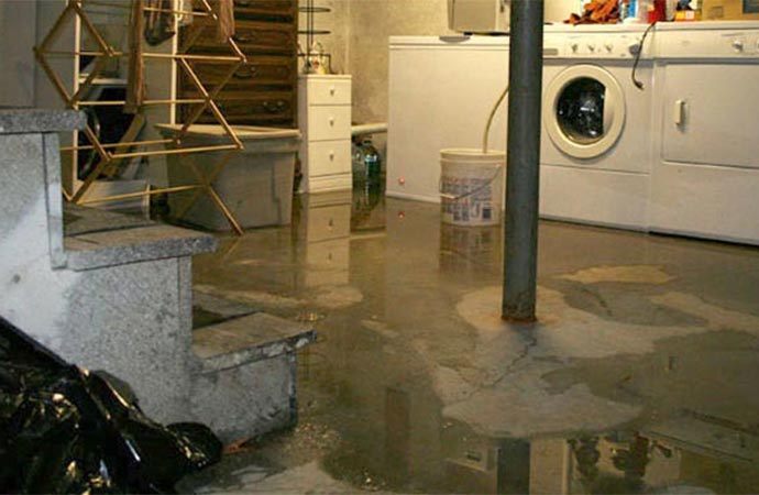 water spreading flooding on room floor damage caused by water leakage